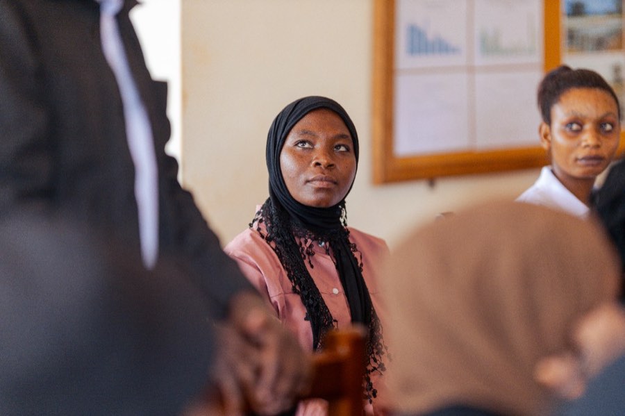 Participant listening attentively in a learning session
